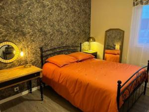 Ένα ή περισσότερα κρεβάτια σε δωμάτιο στο Appartement Etape en presqu'île