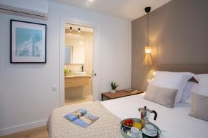 Posteľ alebo postele v izbe v ubytovaní Poeta Llombart Apartment