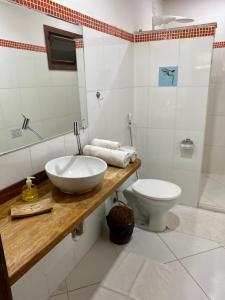 Een badkamer bij Flat Oxóssi