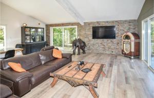 a living room with a couch and an elephant in it at Pet Friendly Home In Trets With Heated Swimming Pool in Trets