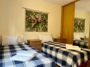 Ένα ή περισσότερα κρεβάτια σε δωμάτιο στο Cruceiro Beach Apartment
