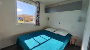 Postel nebo postele na pokoji v ubytování Camping le Camarguais