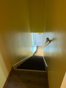 a view of a stairway with a stair case at 2 Bed duplex, close to Millennium Square in Leeds