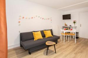 Posezení v ubytování Côté Jardin 2 - Appartement avec Jardin