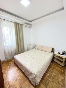 Ένα ή περισσότερα κρεβάτια σε δωμάτιο στο Centro apartments and rooms +11 φωτογραφίες