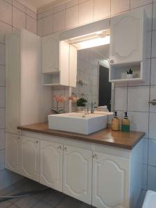 a bathroom with a sink and a mirror at Øren apartment in Drammen