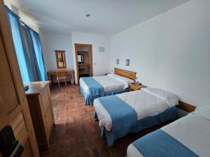 Postel nebo postele na pokoji v ubytování Le Mandrelle Beach Resort