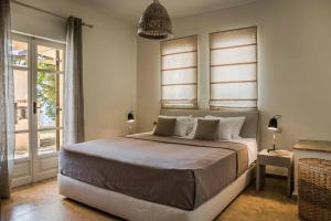 Ένα ή περισσότερα κρεβάτια σε δωμάτιο στο Villa Helios Evreti