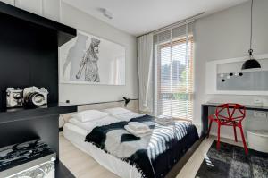 Кровать или кровати в номере Dom & House - Apartamenty Nadmorski Dwór