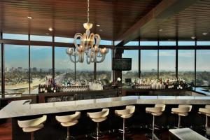 a bar with a view of a city at Hotel Angeleno in Los Angeles