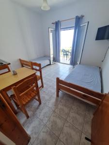 Postel nebo postele na pokoji v ubytování VILLA VRACHOS Preveza