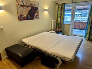 a hospital room with a bed and a window at Aktivurlaub, Wandern, Biken und Baden in Tirol, FeWo 13 in Thiersee