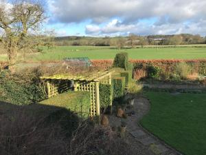 an overhead view of a garden with a bridge at Close House Cottage in York