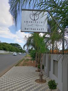 a sign for anamari golf villas on a street at AMANI PALMS GUEST HOUSE in Klerksdorp