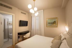 Cama ou camas em um quarto em Daplace - Antica Casa Coppo