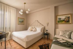 Cama ou camas em um quarto em Daplace - Antica Casa Coppo