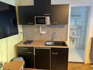 Kuchyňa alebo kuchynka v ubytovaní Alpenlodge, Ferienwohnung 19