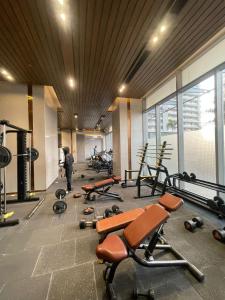 a gym with a bunch of exercise equipment in it at The Sky Stay (By Vrs) in New Delhi