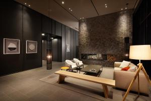 a living room with a couch and a fireplace at Shilla Stay Mapo Hongdae in Seoul +21 photos