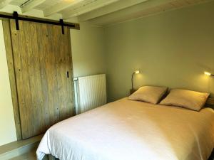 Postel nebo postele na pokoji v ubytování B&B Le Nid d'Hirondelle