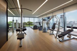 a gym with cardio equipment in a building at Shilla Stay Mapo Hongdae in Seoul