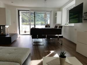 a living room with a piano and a couch at Ferienhaus Johanna in Spitz