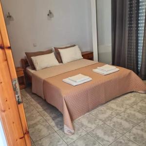 Postel nebo postele na pokoji v ubytování VILLA VRACHOS Preveza