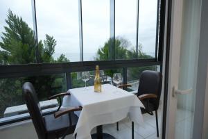 a table with wine glasses and a bottle on it at Seatanbul Hotel in Istanbul