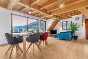 a living room with a table and chairs and a couch at Vorderbühlhof in Oppenau