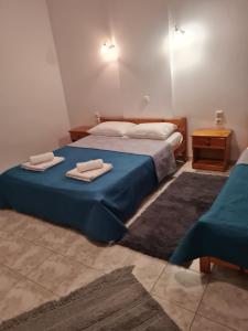 Postel nebo postele na pokoji v ubytování VILLA VRACHOS Preveza