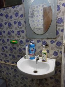 a bathroom with a white sink and a mirror at Private room in Kathmandu, Thamel, Nepal, Boutique in Kathmandu