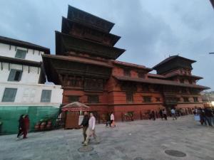 a group of people walking in front of a large building at Private room in Kathmandu, Thamel, Nepal, Boutique in Kathmandu