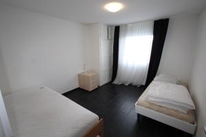 Ένα ή περισσότερα κρεβάτια σε δωμάτιο στο Dulliken