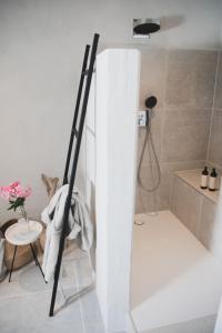 a ladder leaning against a wall in a bathroom at Mas d images styled by Scapa Home in Arles