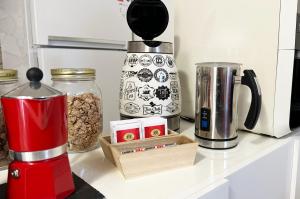 a kitchen counter with a coffee maker and some food at I TREPPONTI in Comacchio