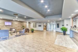 an empty lobby with a table and chairs at Candlewood Suites New Bern, an IHG Hotel in New Bern