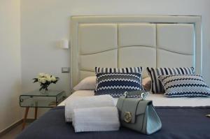 Postel nebo postele na pokoji v ubytování Vera Gioia Rooms de Charme