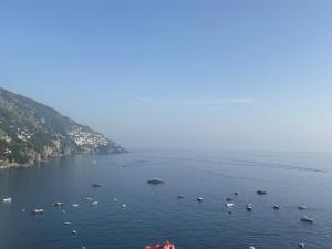 a group of boats in a large body of water at Palazzo Talamo in Positano