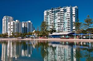 a large body of water with a large building at The Grand Apartments in Gold Coast