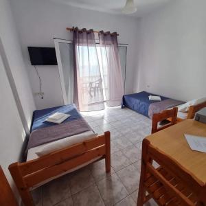 Postel nebo postele na pokoji v ubytování VILLA VRACHOS Preveza