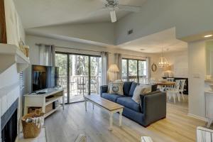 a living room with a couch and a table at Beachwalk 200 in Hilton Head Island