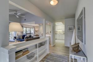 a living room with a blue couch and a table at Beachwalk 200 in Hilton Head Island