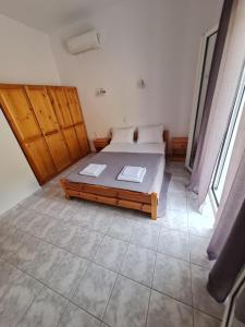 Postel nebo postele na pokoji v ubytování VILLA VRACHOS Preveza