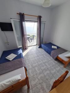Postel nebo postele na pokoji v ubytování VILLA VRACHOS Preveza