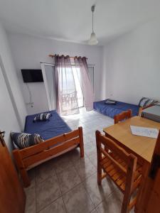 Postel nebo postele na pokoji v ubytování VILLA VRACHOS Preveza