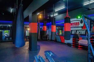 a gym with blue and red punching bags at Ocho Rios Ocean Front Luxury Studio Sky Castles 24 hrs sleeps 2 in Ocho Rios
