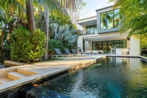 an exterior view of a house with a swimming pool at Villa Celine in Fort Lauderdale