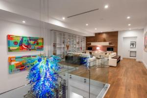 a living room with a glass wall at Villa Celine in Fort Lauderdale