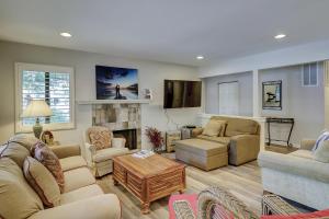 a living room with two couches and a fireplace at Beachwalk 150 in Hilton Head Island