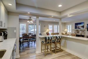 a kitchen and dining room with a table and chairs at Beachwalk 150 in Hilton Head Island